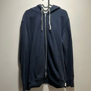 Dark blue Reigning Champ hoodie with zipper
